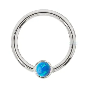 Captive Bead Ring (CBR) in Gold with Bezel-set Sky Blue Opal Captive Bead